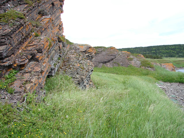 Constructed path between the Goguelin and the Craquelin fishing rooms: French fishing crews have battered away a section of the cliff, to permit passage.